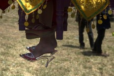 Girls will step their feet on the soil for the first time during the ceremony after being circumcised and isolated. Antara/Rosa Panggabean