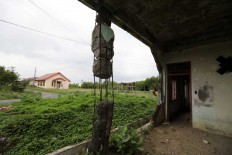 A house damaged by the 2004 tsunami is still standing. JP/Hotli Simanjuntak