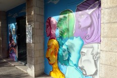 A picture taken on December 18, 2017 shows a graffiti mural on a wall in the Jordanian capital Amman. A tiny group of graffiti artists are on a mission -- daubing flowers, faces and patterns across the capital Amman to bring more colour to the lives of its four million inhabitants.
In a conservative society like Jordan's, the graffiti artists have constantly had to challenge convention to carve out a niche for their works, though still with limits as they steer away from politics and religion. AFP/Khalil Mazraawi 