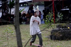 A young artist performs in a pantomime. JP/Maksum Nur Fauzan
