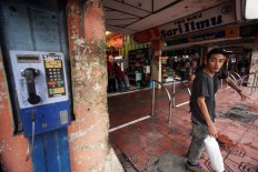 Two men exit a building on Malioboro. JP/Boy T. Harjanto