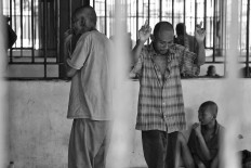 A mentally ill patient dances after a nurse plays music. Antara/Hafidz Mubarak