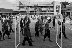 Patients stroll in the yard of the foundation every afternoon.  Antara/Hafidz Mubarak