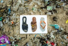 No owner: These sandals that washed up on Jimbaran Beach. JP/Agung Parameswara