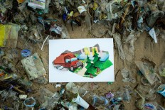 Trashed: A carpet of plastic waste covers Kedonganan Beach in Bali.JP/Agung Parameswara