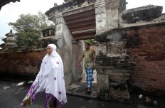 Muslims leave the mosque after prayer. JP/Boy T. Harjanto