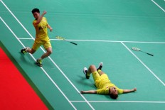 Indonesia Mens Double Kevin Sanjaya-Marcus Gideon celebrate after defeating China Li Junhui - Liu Yuche to win the at the 2018 Indonesia Masters badminton tournament at Istora Senayan, Jakarta on Sunday, January. 28. JP/Seto Wardhana
