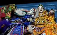 Dolls are arranged neatly before the Potehi puppet show begins. JP/Suherdjoko