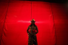 An actor who plays the character of Arjuna poses in between the show. JP/Aditya Sagita