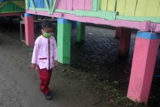 A student walks to class. JP/Maksum Nur Fauzan