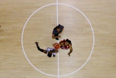 Indonesia and India players vie for the ball during the Asian Games Invitation Tournament match at Hall A Senayan, Jakarta, on Friday, February 9. The tournament is a test event for the upcoming 18th Asian Games in Jakarta and Palembang. JP/Seto Wardhana
