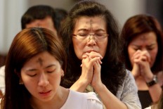 Catholics pray after receiving ash on their foreheads during an Ash Wednesday Mass at Santo Petrus Cathedral in Bandung February 14. JP/Arya Dipa