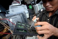 It takes precision and care to fix a broken TV. JP/Boy T. Harjanto