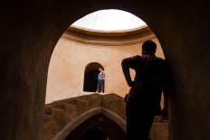 Looking up: Tourists take a look around Sumur Gumuling Mosque in Yogyakarta. JP/ Anggara Mahendra