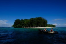 To shote: The ship’s captain Hettie Geenen, heads to one of the Islands at Raja Ampat. JP/Jerry Adiguna