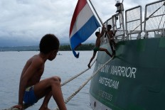Floating playground: Children play around the ship as it is anchored at Manokwari port in West Papua. JP/ Jerry Adiguna
