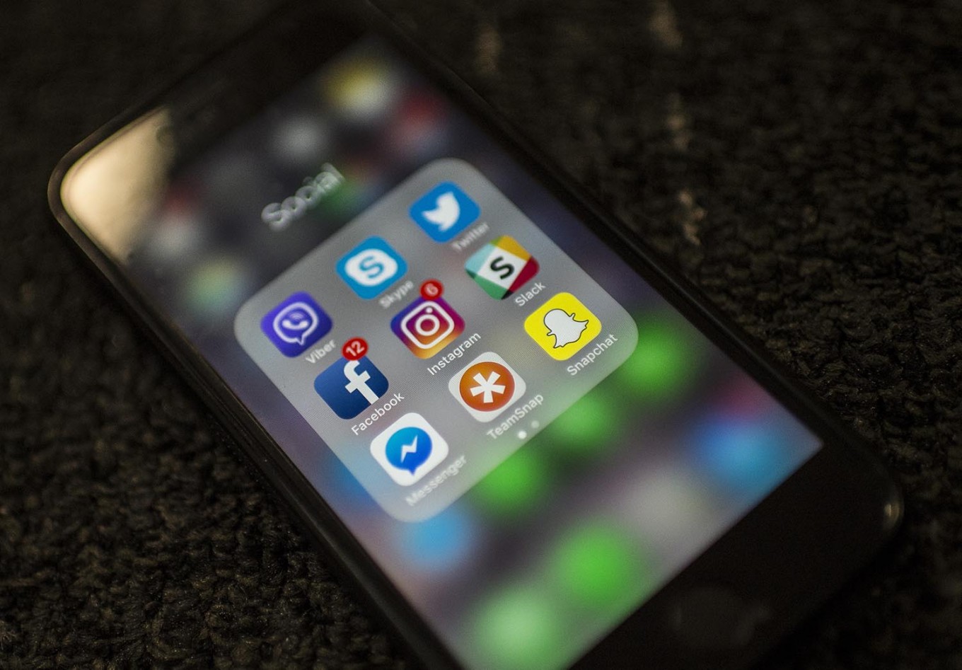 (FILES) In this file photo taken on March 21, 2018 Social Network applications including Facebook, Instagram, Slack, Snapchat, Twitter, Skype, Viber , Teamsnap and Messenger, are on display on a smartphone in Washington DC. Celebrities, brands, leaders and ordinary people are all falling foul of "cancel culture," a movement that seeks to call out offensive behavior but that critics denounce as excessive and contributing to increased political polarization.
