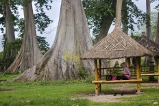 Single and available: A visitors sits in a gaxebo that is said to be a place to wait for your soulmate. JP/Tarko Sudiarno