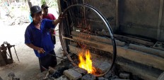 Traditional tools: An iron wheel frame needs to be heated constantly during the forging process. JP/R. Berto Wedhatama
