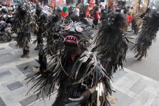 A contingent from Banjar regency, West Java, perform the Jurig Sarengseng ritual during the carnival. The devilish costumes represent bad deeds that need to be cleansed. JP/Arya Dipa