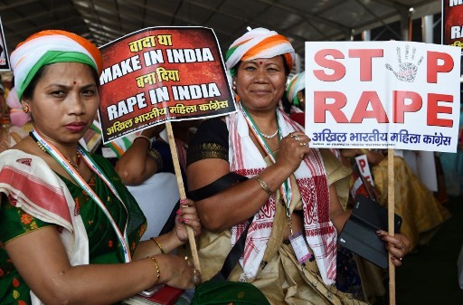 Supporters of President of the Indian National Congress Party Rahul Gandhi hold placards in reaction to the recent rape cases in India during a rally dubbed “Jan Aakrosh Rally” (public outrage), in New Delhi on April 29, 2018.
The rally was Gandhi's first in the national capital since taking over as the party chief last year. The rally was called to launch a protest against Prime Minister Narendra Modi government's “failures and corruption”.
