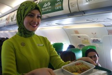 Commentary: Hijab or tight skirt: Airlines still use women's body image to sell tickets