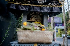 Offerings are placed in the stone alter in Denpasar, Bali. JP/Anggara Mahendra