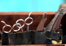 Tools of the trade: Scissors and razors to cut customers' hair. JP/ Boy T Harjanto