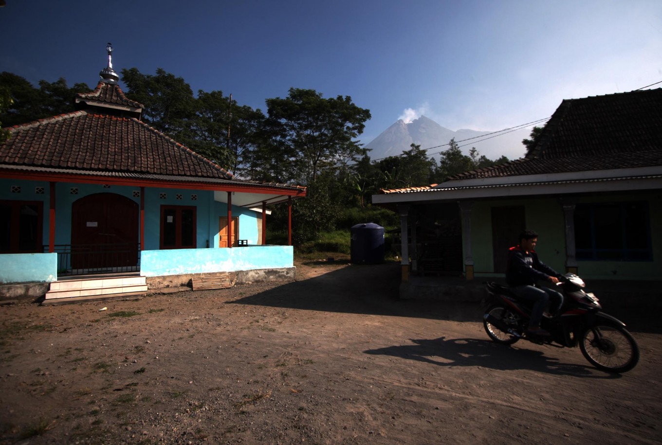 A motorcyclist leaves an empty mosque in Balerante village. JP/Boy T. Harjanto