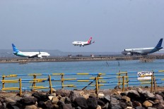 Plane to see: Planes prepare for take off and land at I Gusti Ngurah Rai International Airport in Bali. The airport will serve 724 extra flights for this year’s holiday season.JP/Zul Trio Anggono