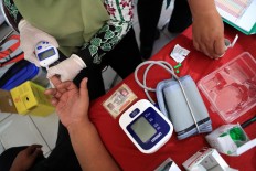 Health check: Drivers check their blood pressure to make sure they can safely drive during the 2018 Idul Fitri exodus. JP/ Seto Wardhana