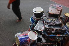 Paints and other tools to create murals. JP/Maksum Nur Fauzan