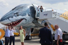 Ready to fight: The Embraer E190-E2 is often considered the Airbus A220-300's main rival in the small jet market. The jet is unique for its shark paint job. JP/ R. Berto Wedhatama