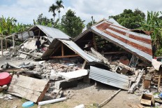 Homes are left destroyed in Sajang village, East Lombok, West Nusa Tenggara, after a 6.4-magnitude earthquake hit the province on July 30, 2018. Antara/Akbar Nugroho Gumay