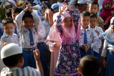 Back to school: Students of Al Irsyad Al Islamiyyah Early Childhood School (PAUD) look enthused about returning to class after the long vacation in Jember, East Java, on Monday, July 16, 2018. JP/Wendra Ajistyatama