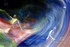 Indonesia Mens Double  Kevin Sanjaya and Markus Gideon perform during their Bli Bli Indonesia Open 2018 Super 1000 quarter final match against Denmark Mads Conrad Petersen- Mads Kolding in Istora Senayan, Jakarta, Wednesday, July 4, 2018. Kevin-Markus won 20-22, 22-20, 21-18. JP/Seto Wardhana.