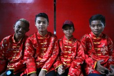Youthful energy: Local boys are the musicians of potehi puppet shows. JP/Boy T Harjanto