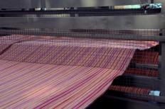 An art installation depicting the process of making lurik is paraded. JP/Magnus Hendratmo