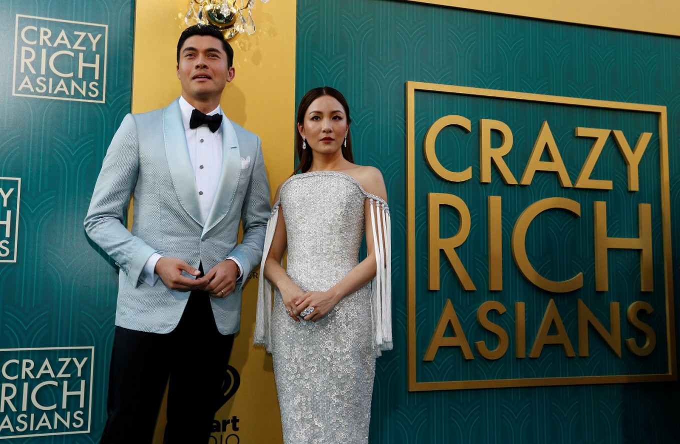 Cast members Henry Golding and Constance Wu pose at the premiere for 'Crazy Rich Asians'.
