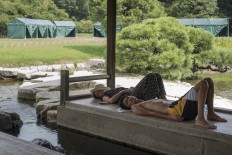 Tourists fall asleep in Korakuen Garden, Okayama. JP/Rosa Panggabean