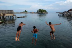 Play around: Children of Bajo tribe play in Kabalutan village on Togean Islands in Tojo Una Una regency, Central Sulawesi. JP/ Jerry Adiguna