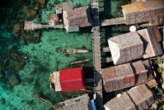 Houses by the sea: An aerial view of Bajo village, Papan Island. JP/ Jerry Adiguna