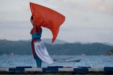 Dance with me: A dancer gives a contemporary touch to Tojo Una Una dance during the opening of Togean International Oceanic Festival on Papan Island. JP/ Jerry Adiguna