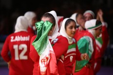 Sweet victory: The Iran women's kabaddi team celebrates its win. The sport, which originated on the Indian sub-continent, is sort of a cross between wrestling, rugby and the playground game of tag. JP/PJ Leo