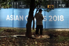 A security officers conducts a prayer in an empty lot in Jakarta. JP/Dhoni Setiawan