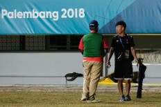 An official bars a photojournalist from covering a women’s soccer qualifier in Palembang, South Sumatra. JP/ Jerry Adiguna
