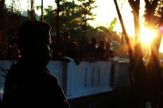 Early riser: Men of the Bonokeling tribal community get ready for the Day of Sacrifice early in the morning. JP/Kukuh Sukmana Hasan Surya