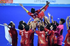 Japan's players celebrate their victory over Malaysia during the men's field hockey final match at the 2018 Asian Games in Jakarta on Sept.1. Inasgoc via Antara/Dhoni Setiawan