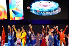Chinese businessman Jack Ma (center) introduces his hometown Hangzhou as the next Games host city during the closing ceremony of the 2018 Asian Games at Bung Karno Stadium. JP/Seto Wardhana