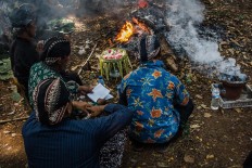Elders of the village pray to God and their ancestors to express gratitude for a prosperous harvest. JP/Anggertimur Lanang Tinarbuko